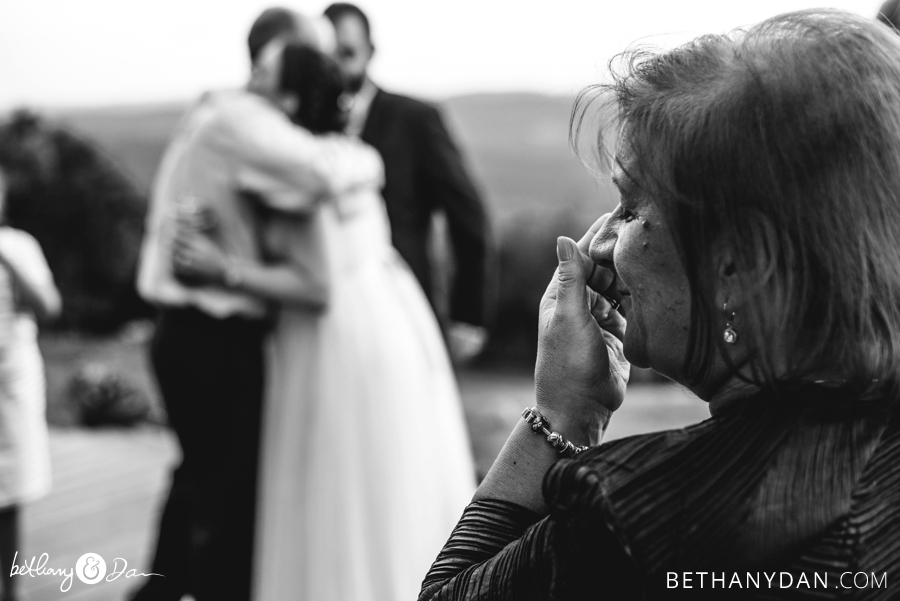 The mother of the groom watches the first dance
