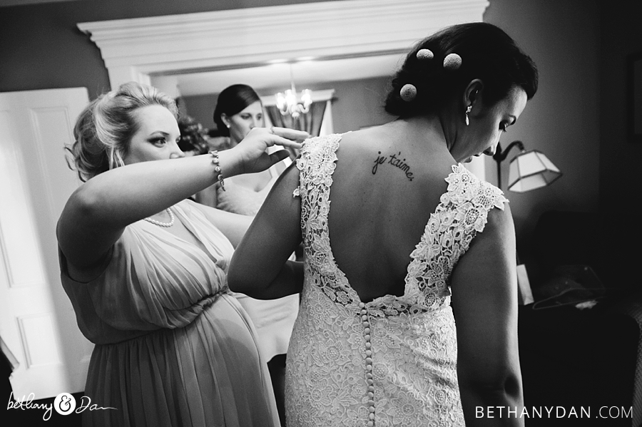 Bridesmaids helping the bride get ready