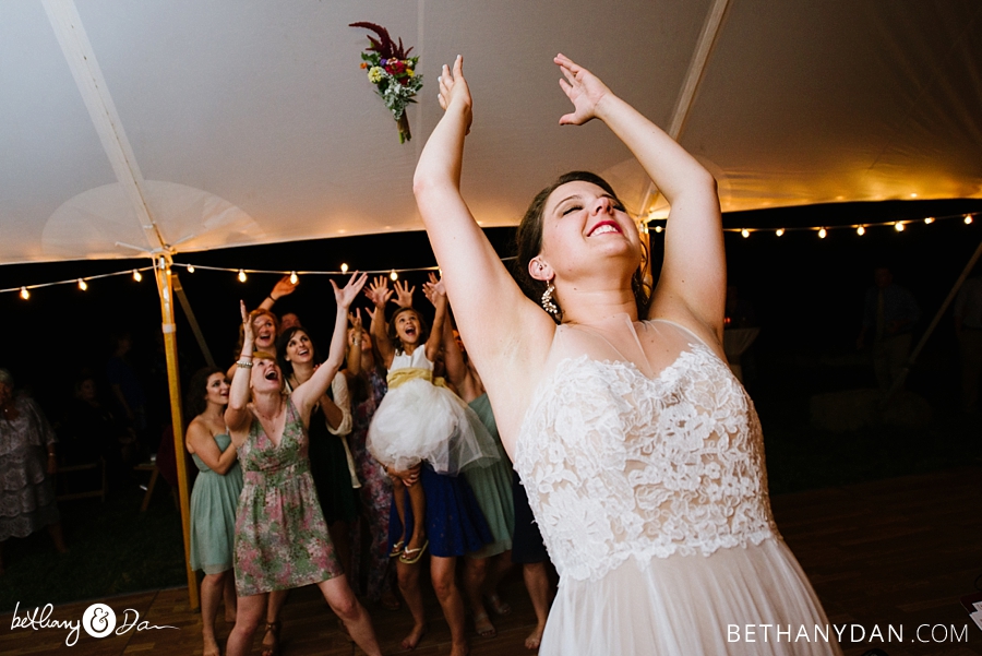 The bride tosses her boquet