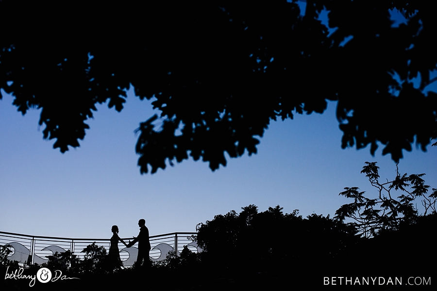 The bride and groom silhoutted 
